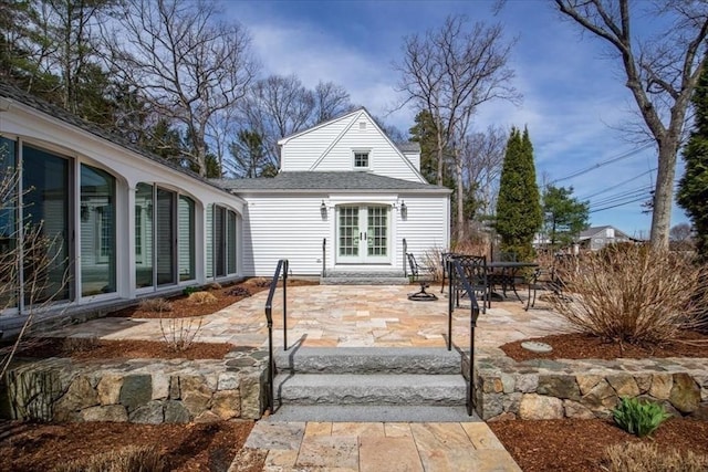 279 Norfolk St, Holliston, MA 01746 - rear view of house featuring french doors, a patio, and roof with shingles