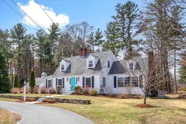 279 Norfolk St, Holliston, MA 01746 - cape cod home with a chimney, a front yard, and a shingled roof