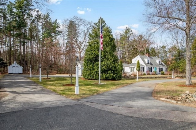 279 Norfolk St, Holliston, MA 01746 - view of asphalt driveway with view of wooded area