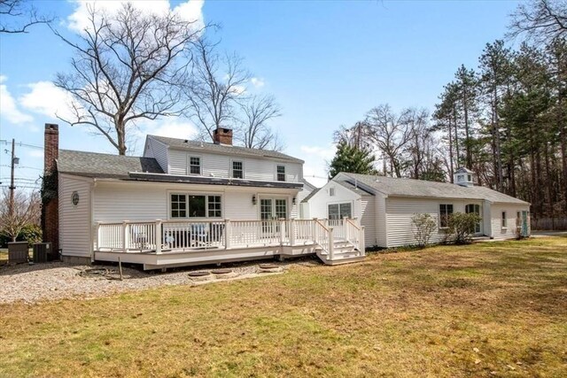 279 Norfolk St, Holliston, MA 01746 - back of house with a chimney, a lawn, and a wooden deck