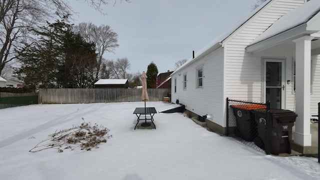 view of yard layered in snow