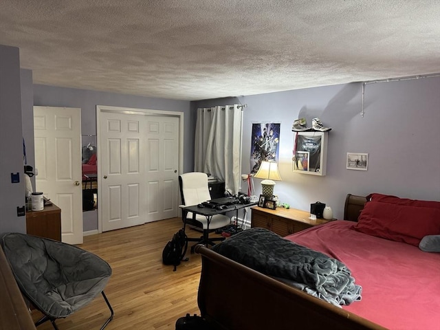251 Waltham St, Newton, MA 02465 - bedroom featuring a textured ceiling, light wood-type flooring, and an office area
