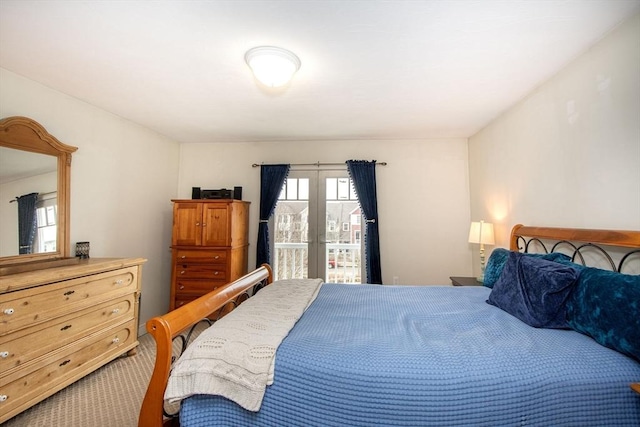 carpeted bedroom featuring french doors