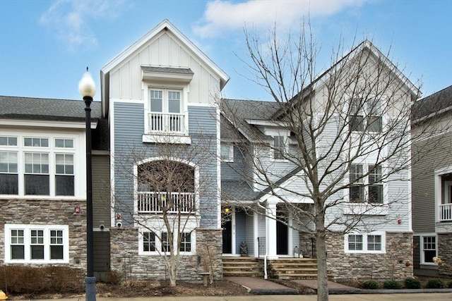 view of front of house with stone siding and board and batten siding