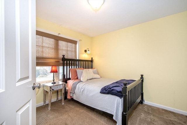 bedroom with carpet flooring and baseboards