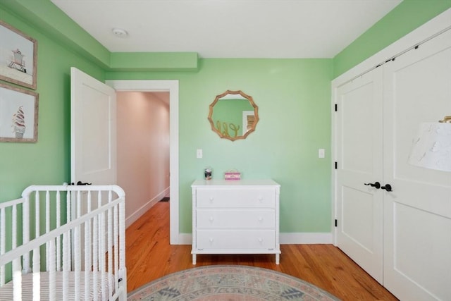 10 Berkley Rd Unit C, Hull, MA 02045 - bedroom featuring light wood-type flooring, baseboards, a closet, and a crib