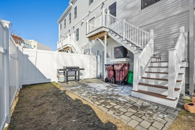 10 Berkley Rd Unit C, Hull, MA 02045 - view of patio featuring stairway, a fenced backyard, and a grill