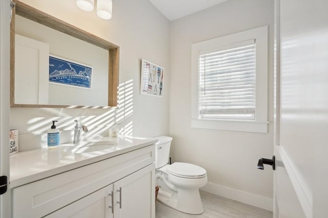 10 Berkley Rd Unit C, Hull, MA 02045 - bathroom featuring toilet, baseboards, vanity, and wood finished floors