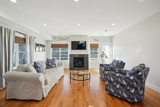 10 Berkley Rd Unit C, Hull, MA 02045 - living room with light wood finished floors, healthy amount of natural light, recessed lighting, and a tiled fireplace