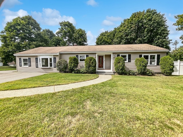 ranch-style home with a front lawn