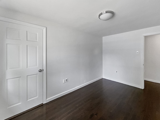 empty room featuring dark hardwood / wood-style floors