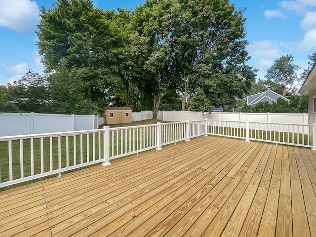 deck with a lawn and a shed