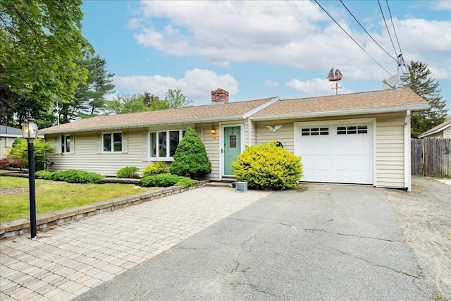 15 Trask Rd, Peabody, MA 01960 - single story home featuring a chimney, driveway, and an attached garage