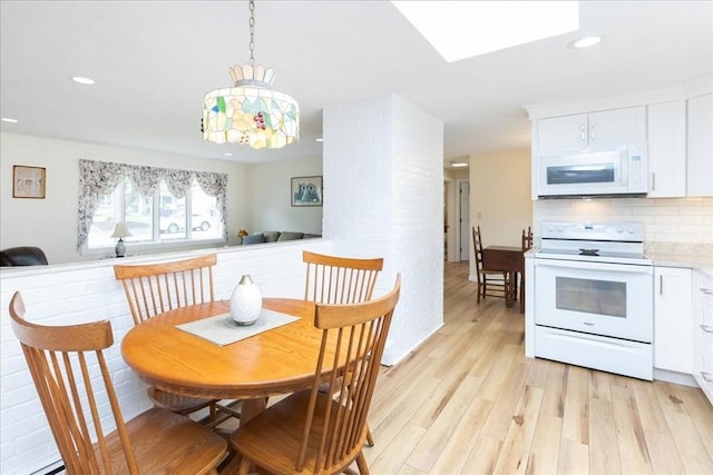 15 Trask Rd, Peabody, MA 01960 - dining room featuring light wood finished floors, recessed lighting, and a skylight