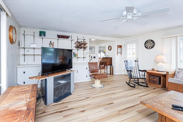 15 Trask Rd, Peabody, MA 01960 - living room with a textured ceiling, light wood-style floors, plenty of natural light, and a ceiling fan