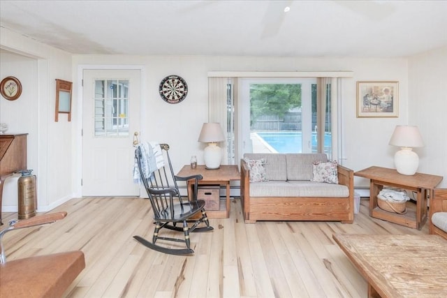 15 Trask Rd, Peabody, MA 01960 - living room with wood finished floors and a baseboard heating unit
