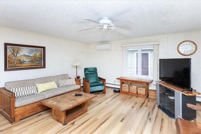 15 Trask Rd, Peabody, MA 01960 - living area featuring a wall mounted AC, light wood-style flooring, baseboard heating, and ceiling fan