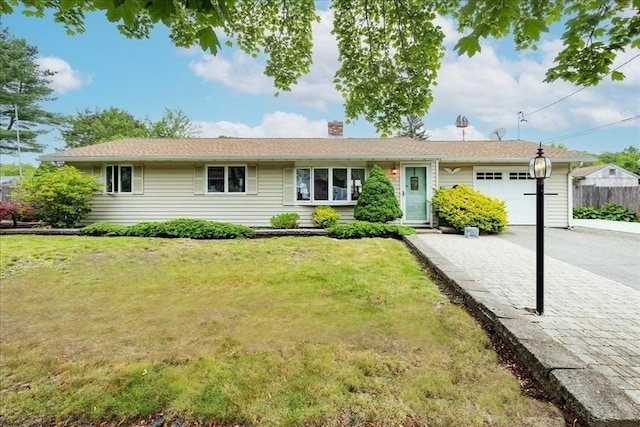 15 Trask Rd, Peabody, MA 01960 - single story home with an attached garage, driveway, and a chimney