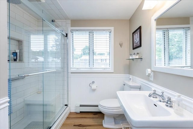 15 Trask Rd, Peabody, MA 01960 - full bath featuring a baseboard radiator, plenty of natural light, wood finished floors, wainscoting, and a stall shower