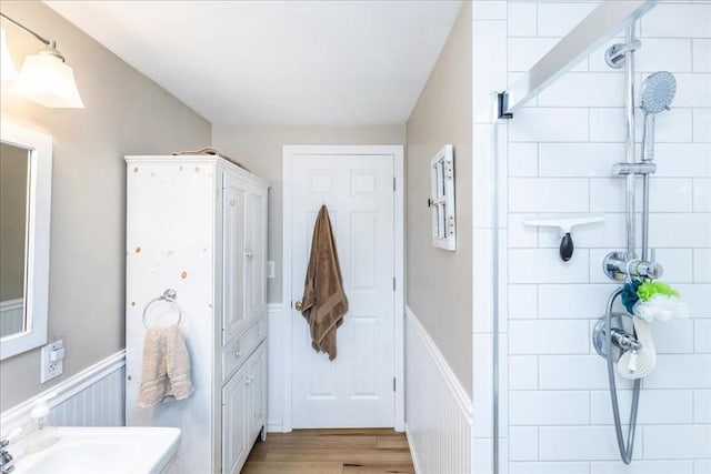 15 Trask Rd, Peabody, MA 01960 - full bathroom with a tile shower, a wainscoted wall, and wood finished floors