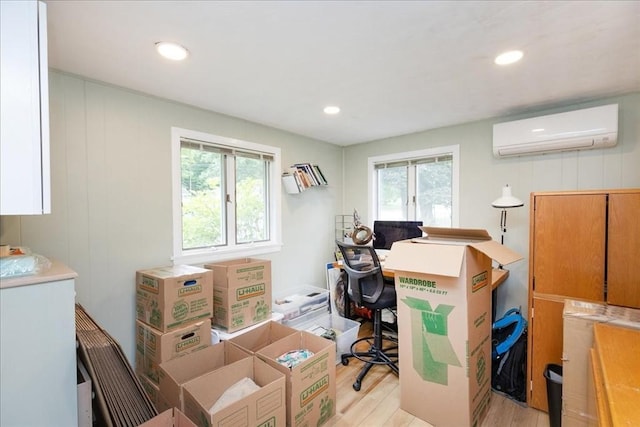 15 Trask Rd, Peabody, MA 01960 - home office with a wall unit AC, light wood-style floors, and recessed lighting