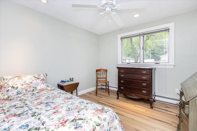 15 Trask Rd, Peabody, MA 01960 - bedroom with light wood finished floors, a baseboard heating unit, recessed lighting, baseboard heating, and ceiling fan