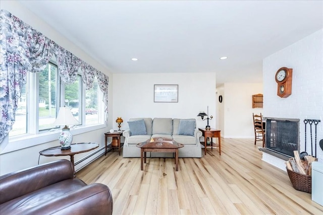 15 Trask Rd, Peabody, MA 01960 - living area with light wood finished floors, a baseboard heating unit, a fireplace, and recessed lighting
