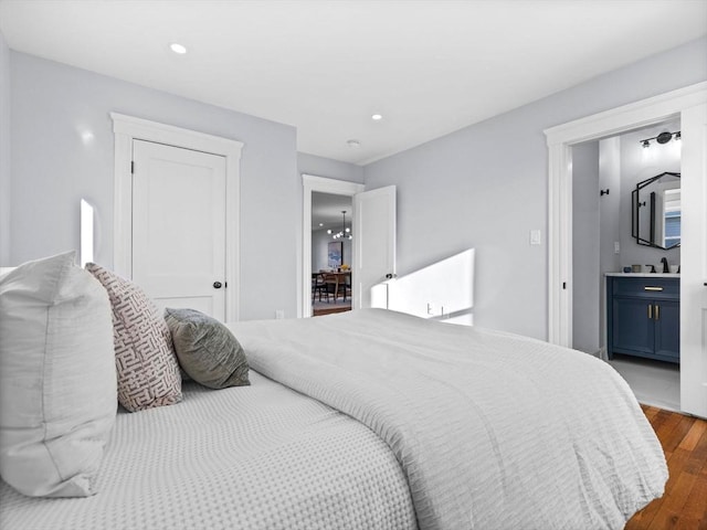 bedroom with dark wood-type flooring and a closet