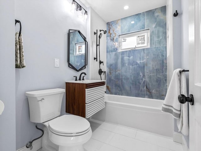 full bathroom with tile patterned flooring, toilet, vanity, and tiled shower / bath