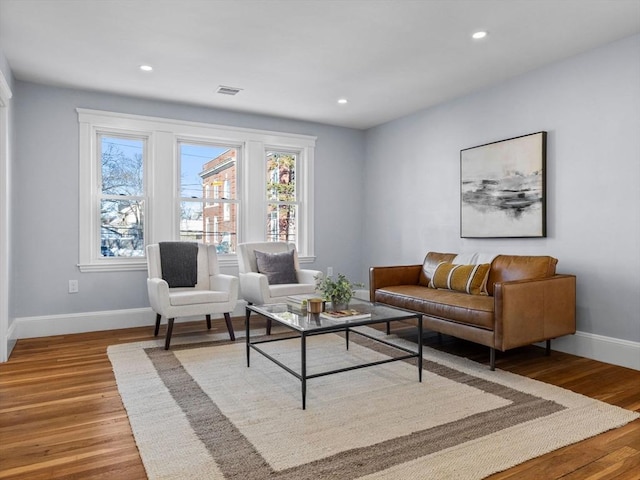 living room with plenty of natural light and light wood-type flooring