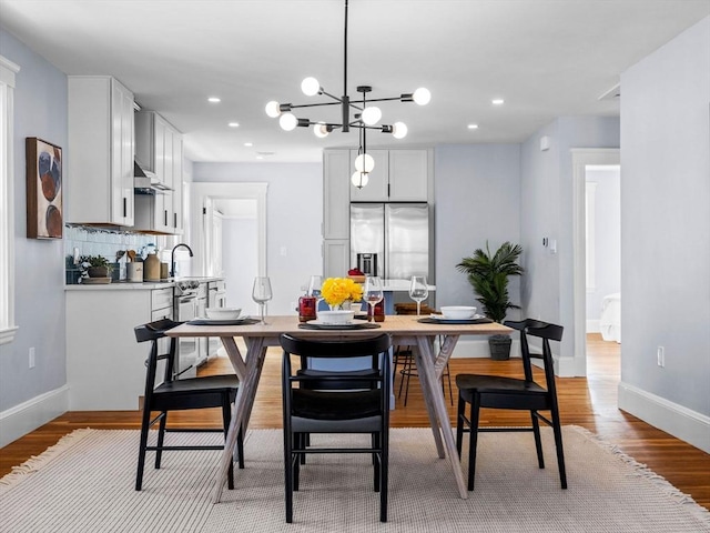 dining space featuring light wood-type flooring