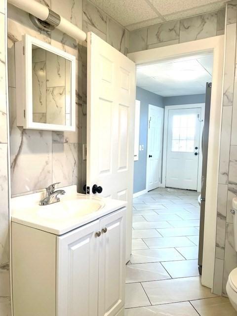 bathroom with vanity and toilet