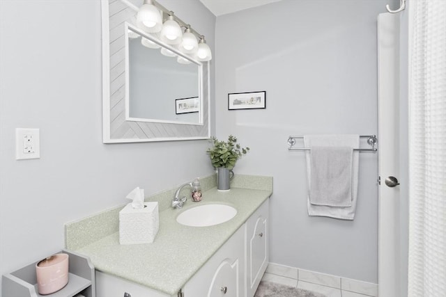 bathroom featuring tile patterned flooring and vanity