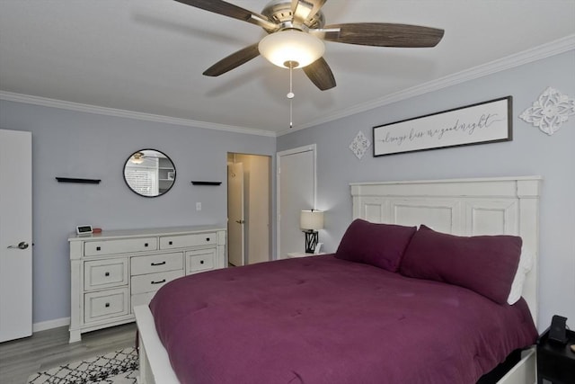 bedroom featuring light wood-type flooring, crown molding, baseboards, and ceiling fan