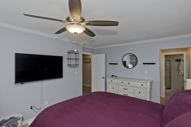 bedroom with ornamental molding and baseboards