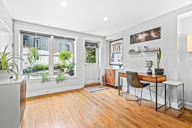 entrance foyer with recessed lighting, light wood-type flooring, and baseboards