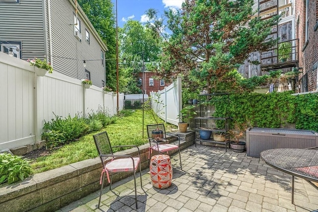 view of patio / terrace featuring cooling unit and a fenced backyard