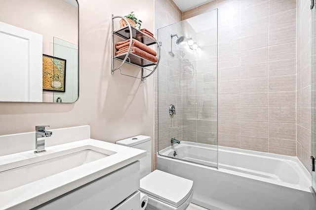 bathroom with vanity, toilet, and washtub / shower combination