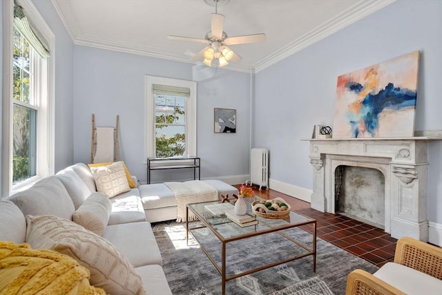 living room with ornamental molding, radiator heating unit, a high end fireplace, and a healthy amount of sunlight