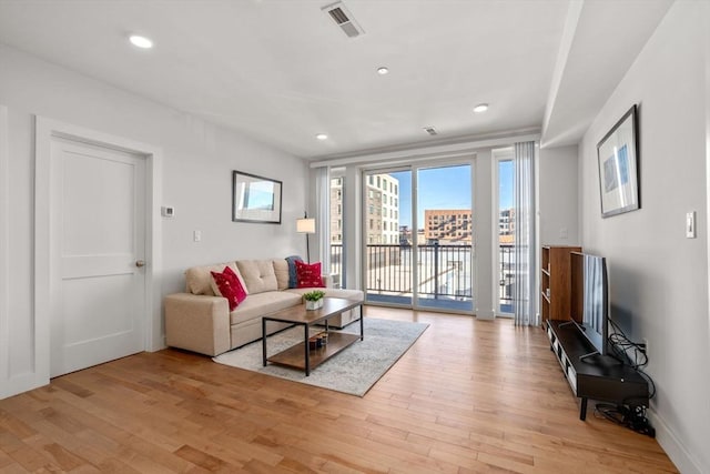 living room with light hardwood / wood-style flooring