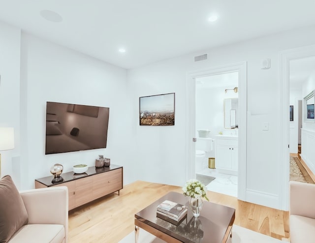 living room with light hardwood / wood-style floors