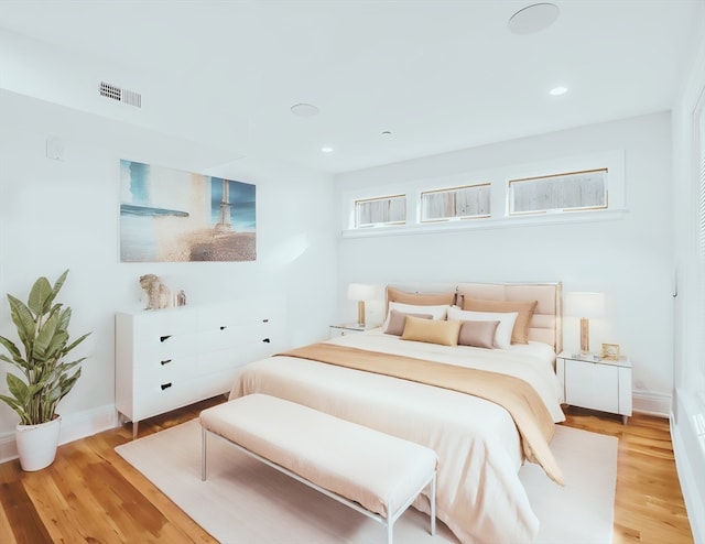 bedroom with light hardwood / wood-style floors