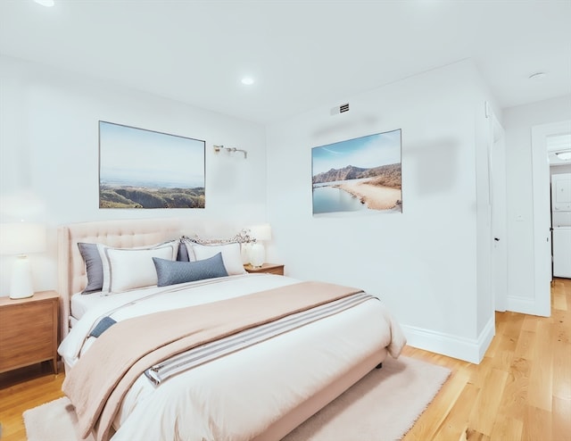 bedroom with light hardwood / wood-style flooring