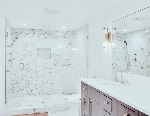 bathroom featuring vanity, an enclosed shower, and toilet