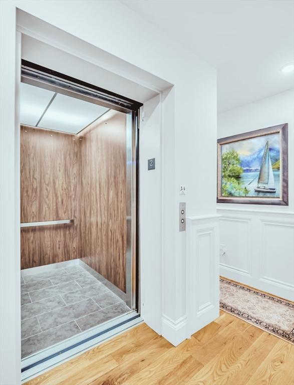 56 Belmont St Unit 3, Boston, MA 02129 - elevator with wood finished floors