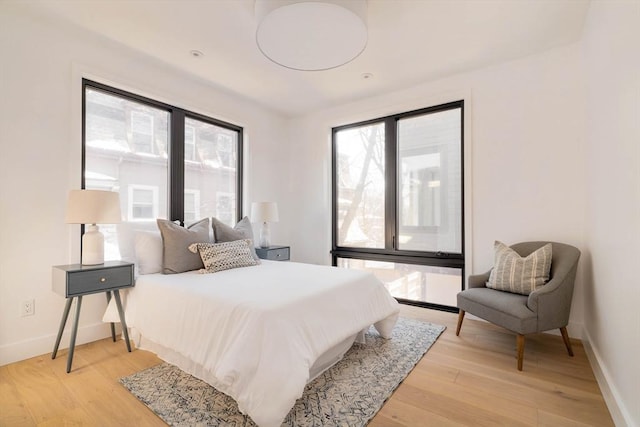 bedroom with light hardwood / wood-style flooring