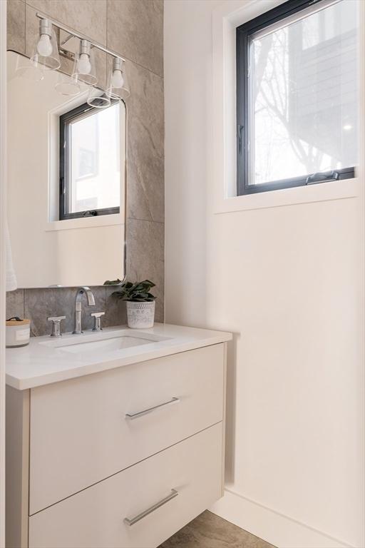 bathroom featuring tile patterned flooring and vanity