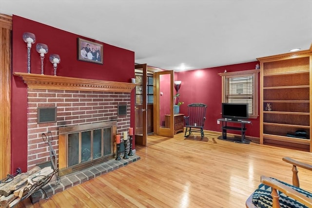 living room featuring a fireplace and hardwood / wood-style flooring