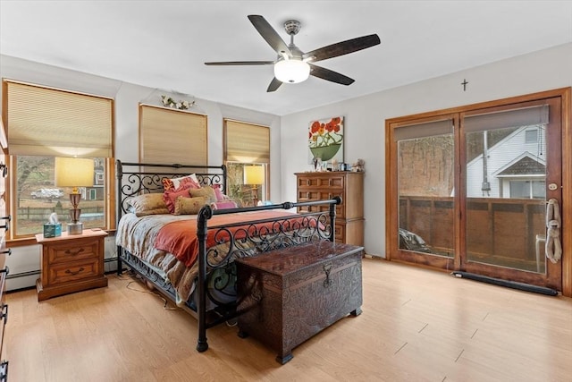 bedroom with light wood-type flooring and ceiling fan