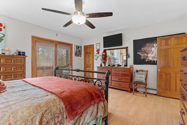 bedroom with light wood-type flooring, ceiling fan, and a baseboard radiator